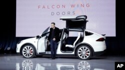 Elon Musk, CEO of Tesla Motors Inc., introduces the Model X car at the company's headquarters in Fremont, Calif., Sept. 29, 2015.