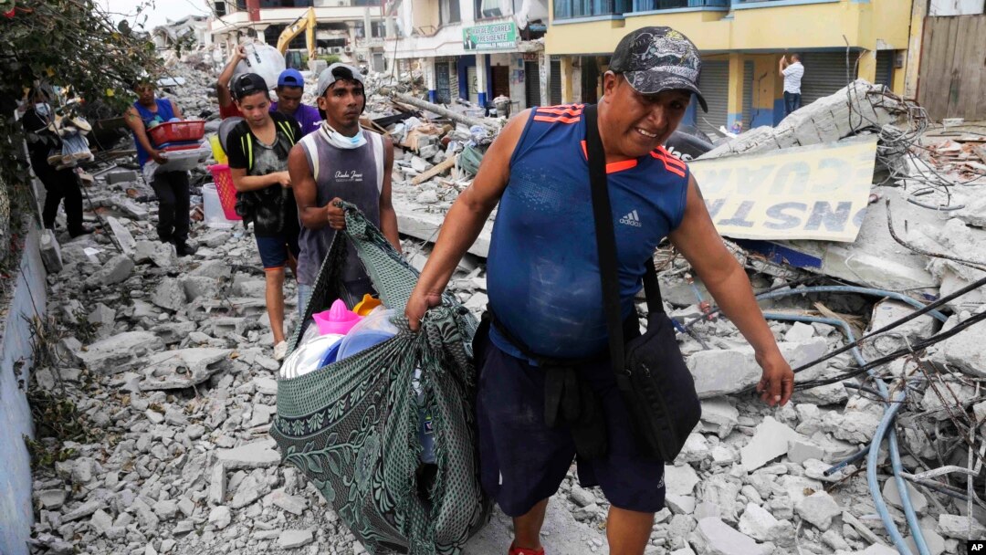 Residents recover their belongings days after an earthquake in Pedernales, Ecuador, April 20, 2016.