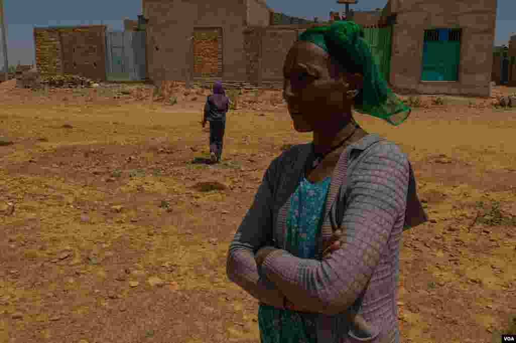  Letay Girmay, 50, says she and other Hawzen residents buried the bodies of many civilians after battles in Hawzen, Ethiopia, on June 6, 2021. (VOA/Yan Boechat) 