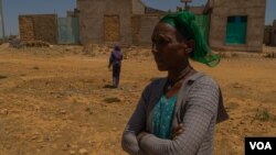  Letay Girmay, 50, says she and other Hawzen residents buried the bodies of many civilians after battles in Hawzen, Ethiopia, on June 6, 2021. (VOA/Yan Boechat) 