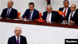 FILE - Turkey's main opposition Republican People's Party leader Kemal Kilicdaroglu speaks at the Turkish parliament in Ankara, Turkey, July 15, 2017. 