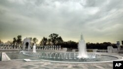 With all of the fountains turned on, workers put the final touches on the World War II Memorial. File photo.