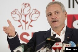 FILE - Leader of Romania's leftist Social Democrat Party (PSD), Liviu Dragnea, gestures during a press conference following the end of the parliamentary elections, in Bucharest, Romania, Dec. 11, 2016.