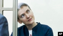 Nadiya Savchenko sits in a glass cage during proceedings against her in a court in Donetsk, in Russia's Rostov-on-Don region, March 21, 2016. 