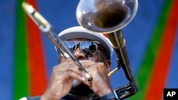 Big Sam, of Big Sam's Funky Nation, performs at the New Orleans Jazz and Heritage Festival in New Orleans, Saturday, April 23, 2016. (AP Photo/Gerald Herbert)