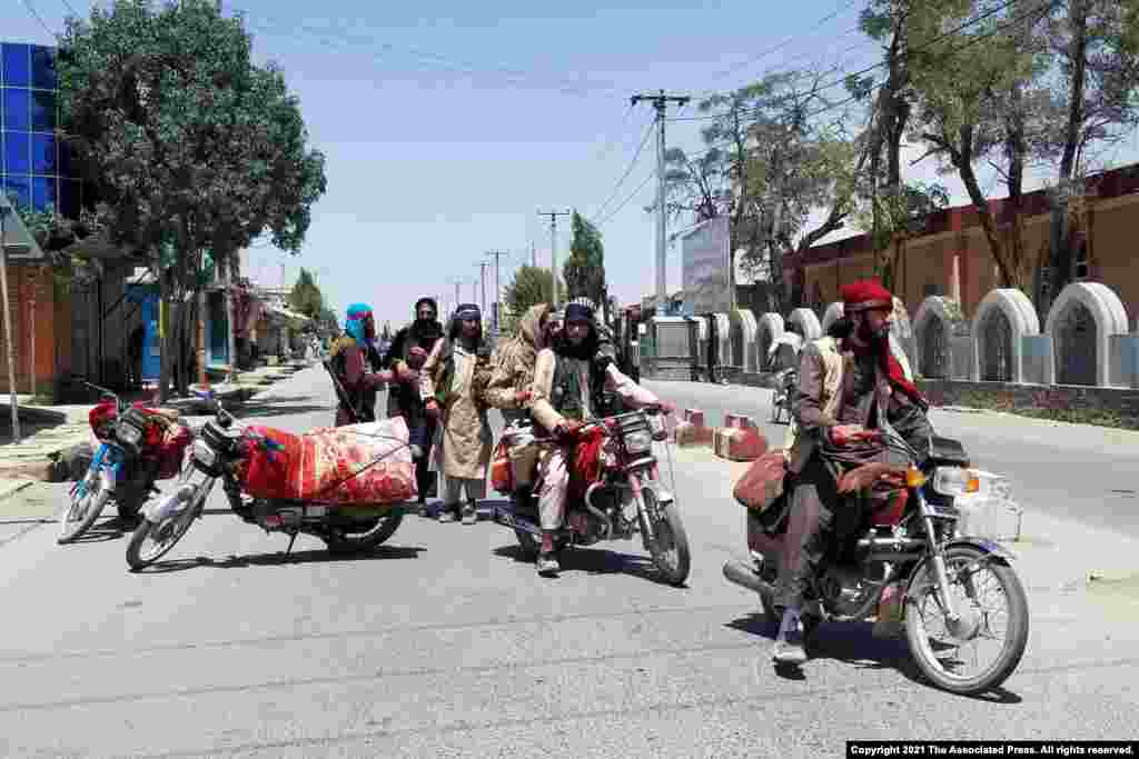 Taliban fighters patrol inside the city of Ghazni, southwest of Kabul, Afghanistan, and it&#39;s at least the 10th provincial capital the insurgents have taken in the past recently across the country.