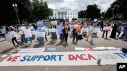 Supporters of Deferred Action for Childhood Arrivals program (DACA), demonstrate on Pennsylvania Avenue in front of the White House in Washington, Sept. 3, 2017.