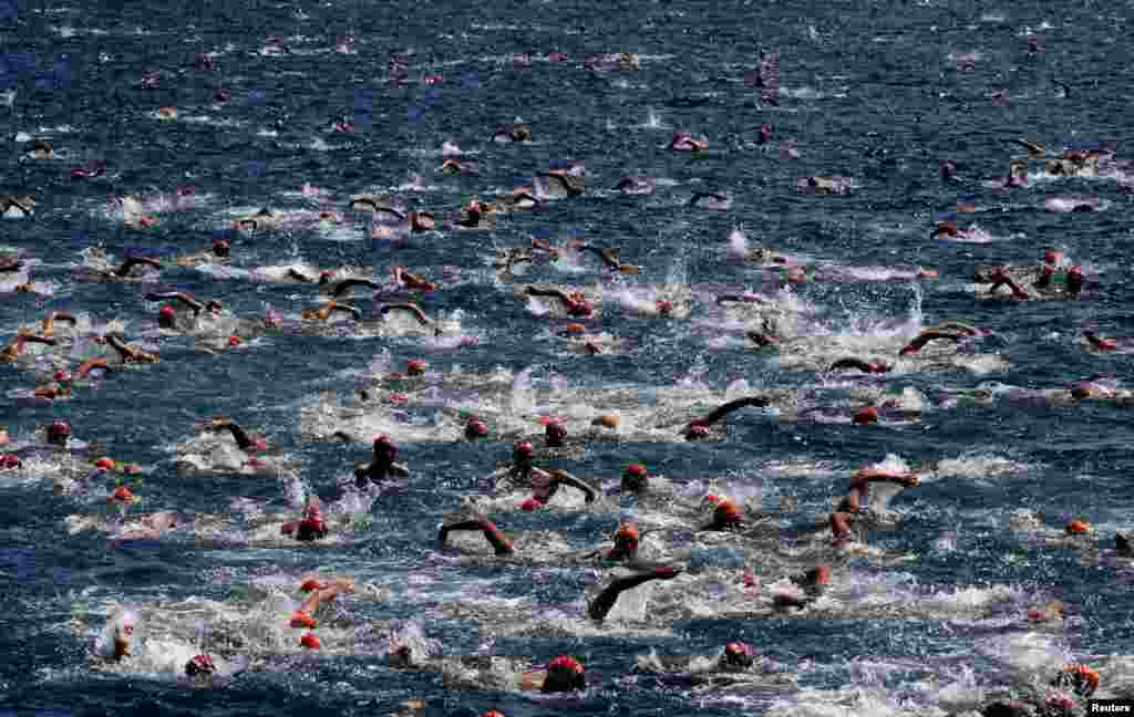 Competitors participate in the 31st Bosphorus Cross-Continental Swimming Race across the Bosphorus strait between Istanbul&#39;s Asian and European sides, Turkey.