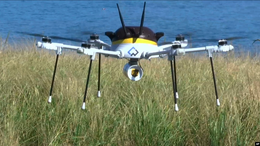 A still image taken from video shows a test drone making a UPS delivery lands on Children's Island in Marblehead, Mass., Sept. 22, 2016.