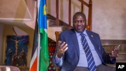 FILE - South Sudan rebel leader Riek Machar talks to reporters at his private residence in Ethiopian capital, Addis Ababa, Feb. 13, 2016.