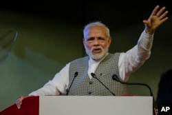Indian Prime Minister Narendra Modi speaks during a function to inaugurate the Kishanganga hydropower station in Srinagar, Indian-controlled Kashmir, May 19, 2018.