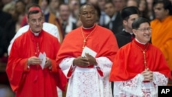 Bechara Boutros Rai, Patriarch of Antioch of the Maronites in Lebanon (far left), Nigeria's Archbishop John Olorunfemi Onaiyekan (center) and Philippines Archbishop Luis Antonio Tagle (right) attend a consistory presided by Pope Benedict XVI inside St. Peter's Basilica at the Vatican, Nov. 24, 2012. 