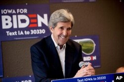 FILE - In this Jan. 9, 2020, file photo former Secretary of State John Kerry smiles while speaking at a campaign stop to support Democratic presidential candidate former Vice President Joe Biden in Fort Dodge, Iowa.