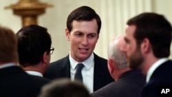 FILE - In this June 29, 2018, file photo, White House adviser Jared Kushner speaks with people as they wait for President Donald Trump to arrive in the East Room of the White House.