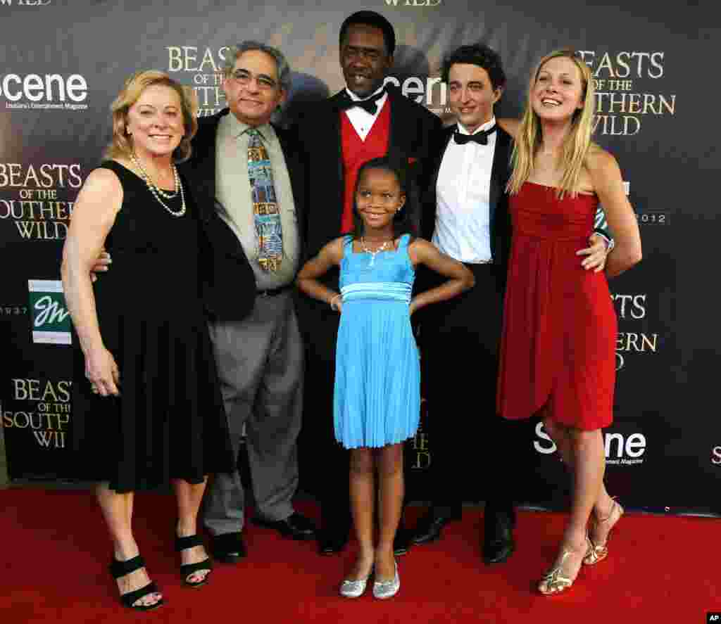 Cast members and Fox Searchlight executives pose on the red carpet at the movie premiere of "Beasts Of The Southern Wild" at the Joy Theater in New Orleans, Louisiana, June 25, 2012.