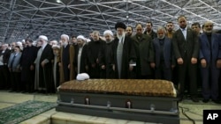 In this picture released by an official website of the office of the Iranian supreme leader, Supreme Leader Ayatollah Ali Khamenei, foreground center, leads a prayer over the casket of former President Akbar Hashemi Rafsanjani at the Tehran University cam