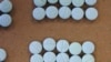 FILE - This undated photo provided by the Cuyahoga County Medical Examiner’s Office shows fentanyl pills. 