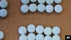 FILE - This undated photo shows fentanyl pills. 
