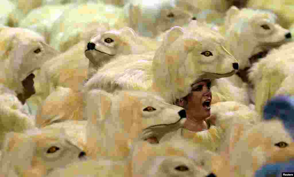 Revelers from the Mocidade Alegre Samba School take part in Carnival at Anhembi Sambadrome in Sao Paulo, Brazil.