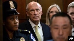 FILE - Director of National Intelligence Dan Coats arrives as House and Senate lawmakers from both parties gather for a classified briefing in a secure room .