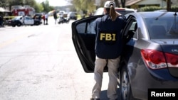 Un agent du FBI sur les lieux d'une explosion au Texas, le 12 mars 2018.