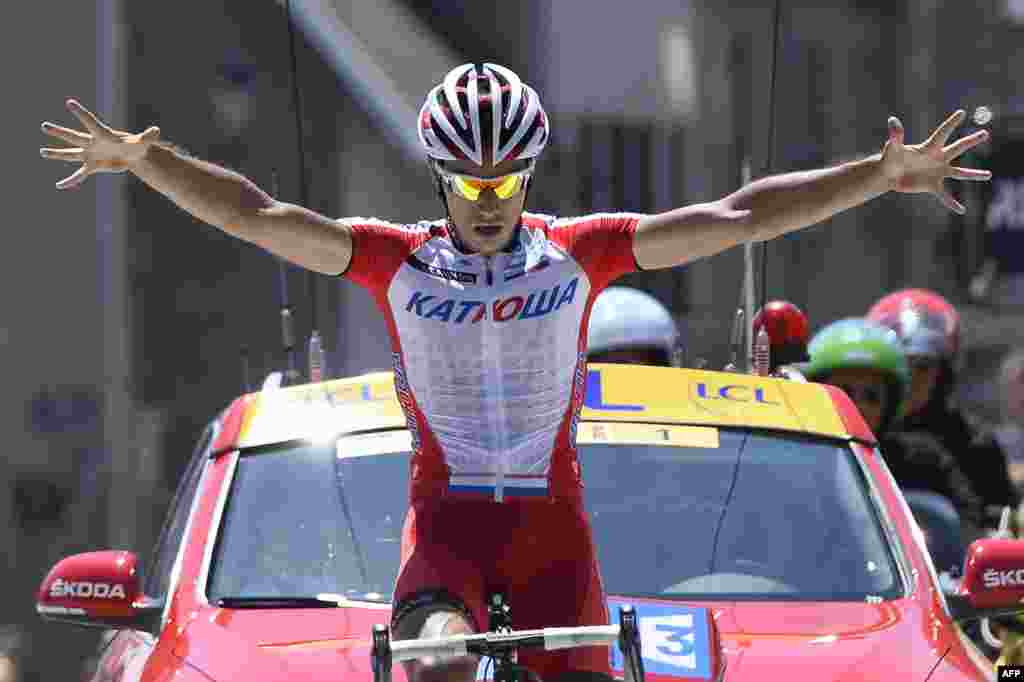 Slovenian cyclist Simon Spilak celebrates at the finish line after winning the fifth stage (Sisteron - La Mure) of the 66th Dauphine Criterium cycling race in La Mure, France.