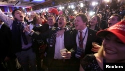 Supporters of U.S. Republican presidential nominee Donald Trump react at his election night rally in Manhattan, New York, Nov. 8, 2016.