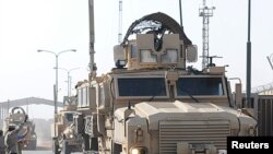 A team of 13 U.S. Marine Corps trainers assigned to the Iraqi Marine Training Team 03 depart the Iraqi city of Umm Qasr in this handout photograph taken on October 14, 2011 and obtained on October 21, 2011.