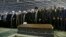 In this picture released by an official website of the office of the Iranian supreme leader, Supreme Leader Ayatollah Ali Khamenei, foreground center, leads a prayer over the casket of former President Akbar Hashemi Rafsanjani at the Tehran University cam