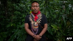 FILE - Alex Lucitante, of the indigenous Cofan ethnic group, poses for a picture at Avie village, in Lago Agrio, Sucumbíos Province, Amazon region, Ecuador, on January 15, 2023.