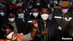 Zambian President Edgar Lungu greets supporters after casting his ballot in Lusaka, Zambia, August 12, 2021. REUTERS/Jean Ndaisenga