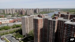 Apartment buildings within Co-op City sit along the banks of the Hutchinson River in the Bronx borough of New York; the virus has killed at least 155 people living in the zip code that covers the complex, roughly 1 of every 282 residents.