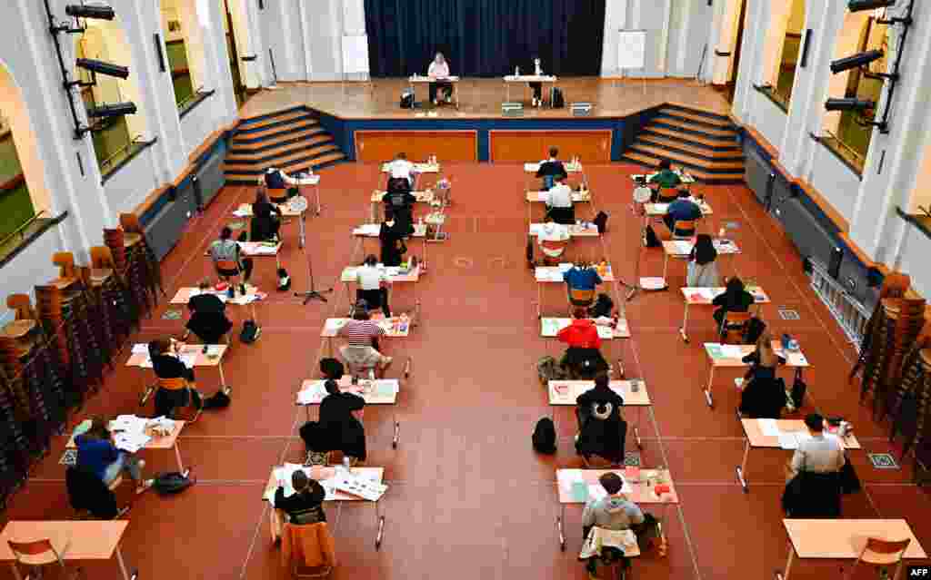 Students take the Biology Abitur (high school graduation) examination in the assembly hall of the Paul-Natorp-Gymnasium secondary school in Berlin, Germany.