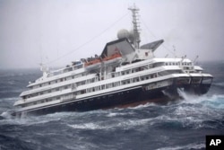 FILE - This photo shows the Antarctic tourist ship Clelia II struggling in high seas with 165 people aboard in the southern Drake Passage, just north of the Shetland Islands, Dec. 7, 2010.
