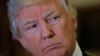 President-elect Donald Trump listens to questions from reporters in the lobby at Trump Tower in New York, Jan. 9. 2017.