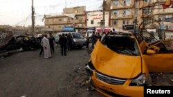 19일 이라크 수도 바그다드의 차량 폭탄 테러 현장.