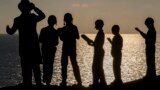 Ultra-Orthodox Jewish boys pray along the Mediterranean Sea in the Israeli city of Herzliya, near Tel Aviv, while performing the "Tashlich" ritual during which "sins are cast into the water to the fish."