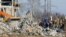 FILE: Workers remove debris of a destroyed building used as shelter for Russian soldiers, 63 of whom were killed in a Ukrainian missile strike as stated the previous day by Russia's Defence Ministry, in Makiivka (Makeyevka), Russian-controlled Ukraine, January 3, 2023.