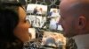 Silvia Carlucci and Domenico Fabiani, who were fired by the Vatican Bank in October 2024, after their wedding violated a ban on workplace marriage, show their wedding photos during an interview with The Associated Press in Rome, Jan. 27, 2025. 