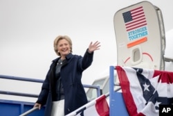 FILE - Democratic presidential candidate Hillary Clinton arrives at Pueblo Memorial Airport in Pueblo, Colo., Oct. 12, 2016.