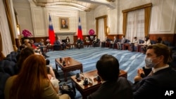 U.S. Representative Mark Takano, D-Calif. center left chats with Taiwanese President Tsai Ing-wen near other members of the U.S. delegation at the Presidential Office in Taipei, Taiwan, Nov. 26, 2021.