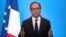 French President Francois Hollande, seen in this picture taken from French TV, makes a televised address from the Elysee Palace in Paris, Dec. 1, 2016. 