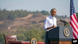 FILE - President Barack Obama speaks at Frank G. Bonelli Regional Park in San Dimas, Calif., as he designated the nearly 350,000 acres within the San Gabriel Mountains northeast of Los Angeles a national monument, Oct. 20, 2014. Obama is granting national