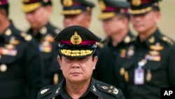 FILE - Thai new Prime Minister Prayuth Chan–ocha arrives to attend an establishment anniversary of the 21st Infantry Regiment, Queen's Guard in Chonburi Province ,Thailand, Aug. 21, 2014. 