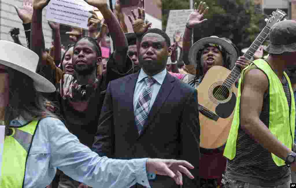 Demonstrators march through the streets of downtown Atlanta, Ga., in protest of the shooting death of 18-year-old Michael Brown, Aug. 18, 2014.