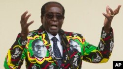 FILE - Zimbabwean President Robert Mugabe addresses people at an event before the closure of his party's 16th Annual Peoples Conference in Masvingo, south of the capital Harare. 