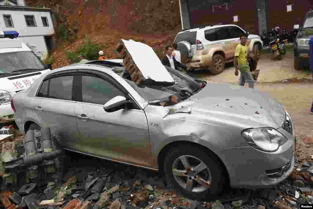 A car smashed by debris after an earthquake hit Longtoushan township, Ludian county, Yunnan province, Aug. 4, 2014.&nbsp;