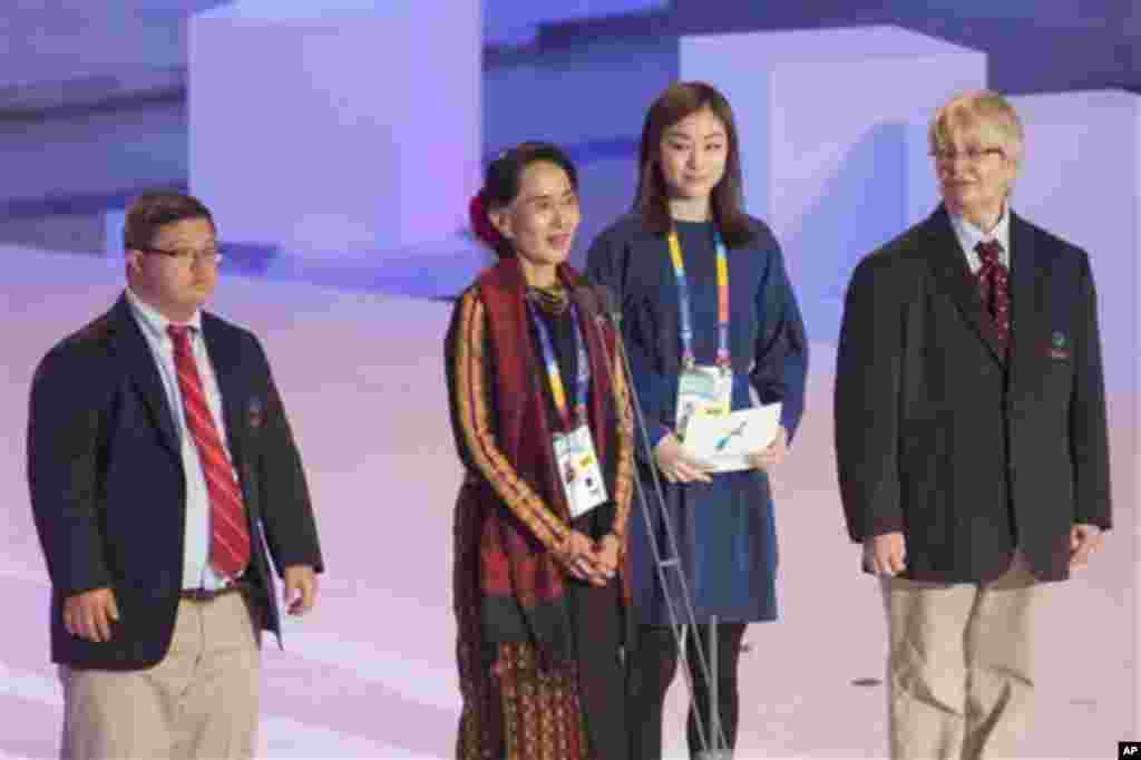 IMAGE DISTRIBUTED FOR SPECIAL OLYMPICS - Daw Aung San Suu Kyi, second from left, speaks at the Special Olympics World Winter Games opening ceremony, along with Ariel Ary, left, Olympic gold medalist Yuna Kim and Caroline Verdenal in PyeongChang, South Ko