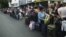 People queue while they wait to cross the border to Colombia at San Antonio in Tachira state, Venezuela, Aug.t 23, 2015. 