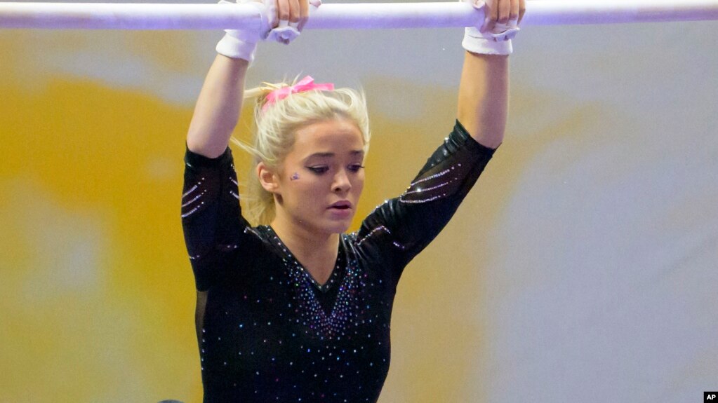 FILE - Livvy Dunne, seen here on Feb. 5, 2022, is a gymnast at LSU. She has millions of social media followers and is making money through name, image, likeness, or NIL deals. (AP Photo/Matthew Hinton, File)